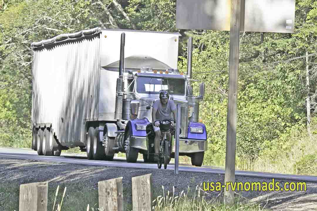 Big semi passing a bicyclist on Pacific Coast Highway 101.