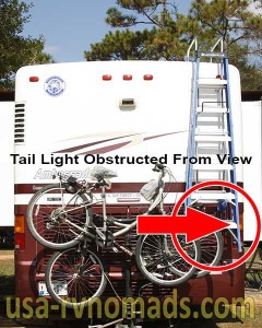 This RV step ladder obstructs the right tail light.